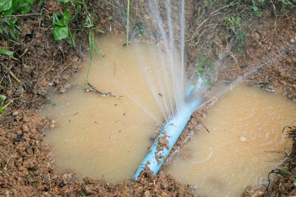 Burst pipe underground from overflowing rain drain